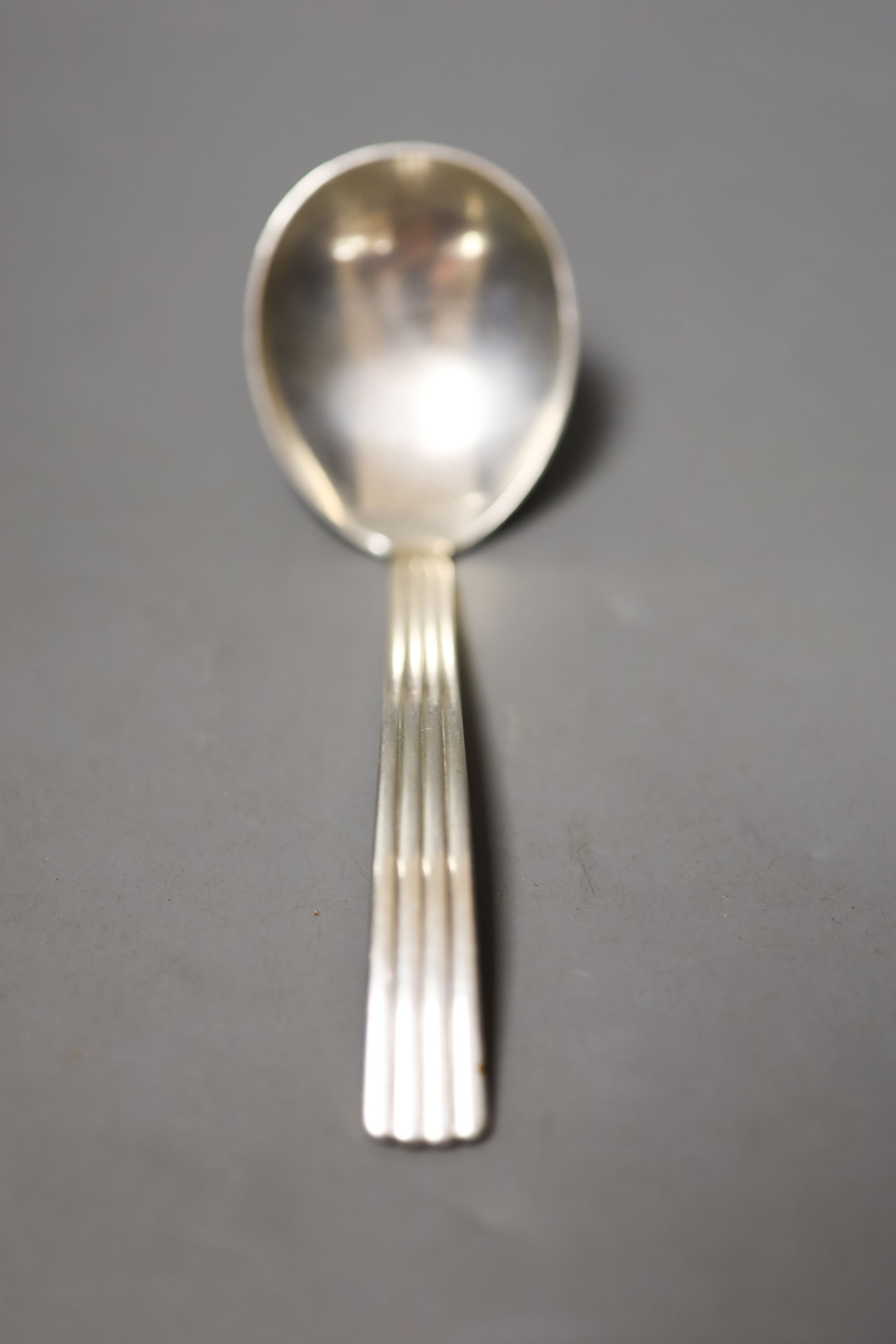 A O. Mogensen sterling cake slice, design no. 35, 25cm and a Georg Jensen sterling sauce ladle, 16cm, 5.5oz.